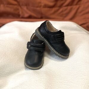 Boy size 24 black dress shoe.